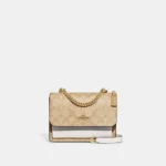 Bandolera mini Klare en lona exclusiva